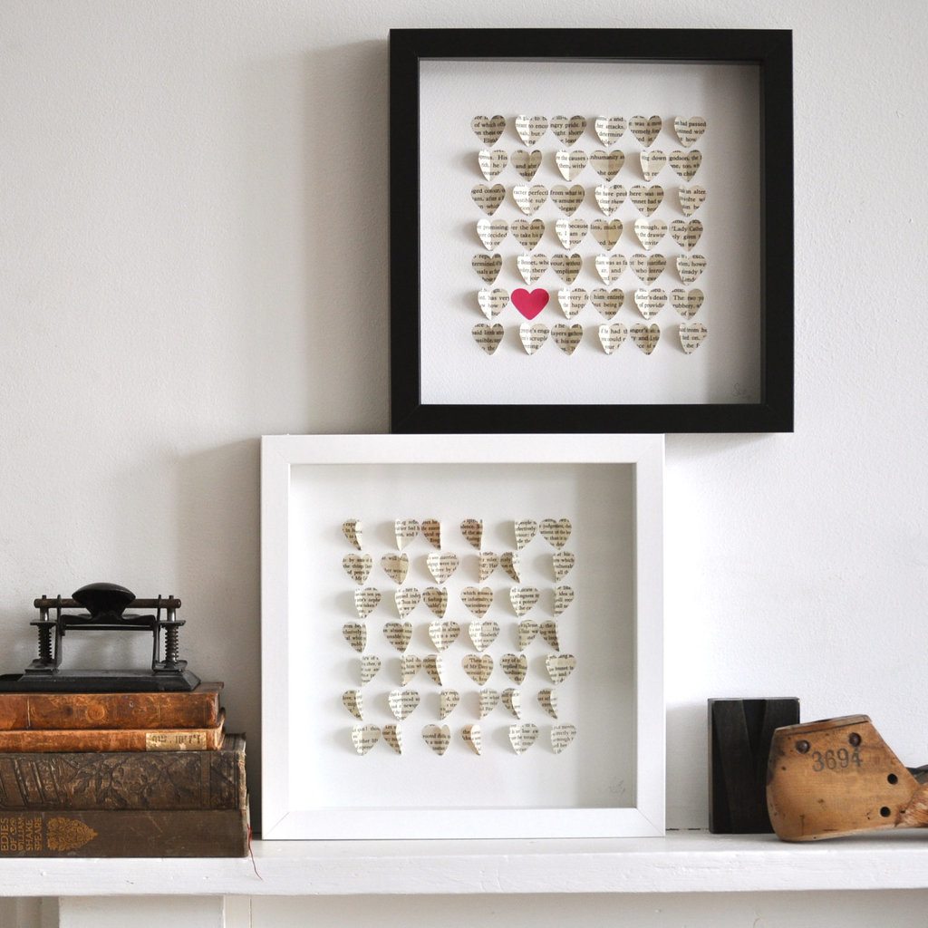 a frame with heart cut out papers