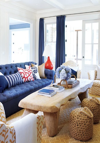 living area with blue upholstered sofa