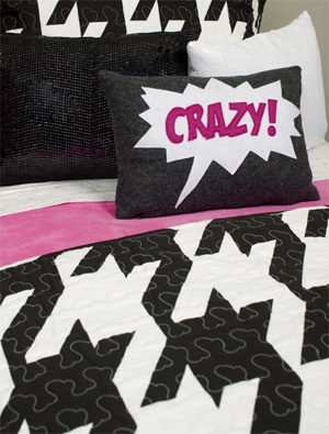 black, white and pink bedding with "crazy" text on pillow