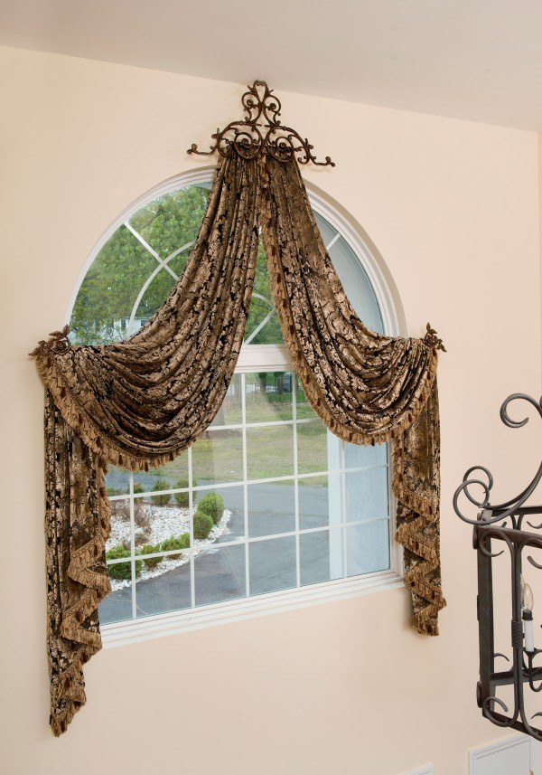 large arched window with curtains 