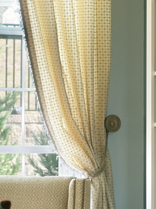 large window with printed long curtain