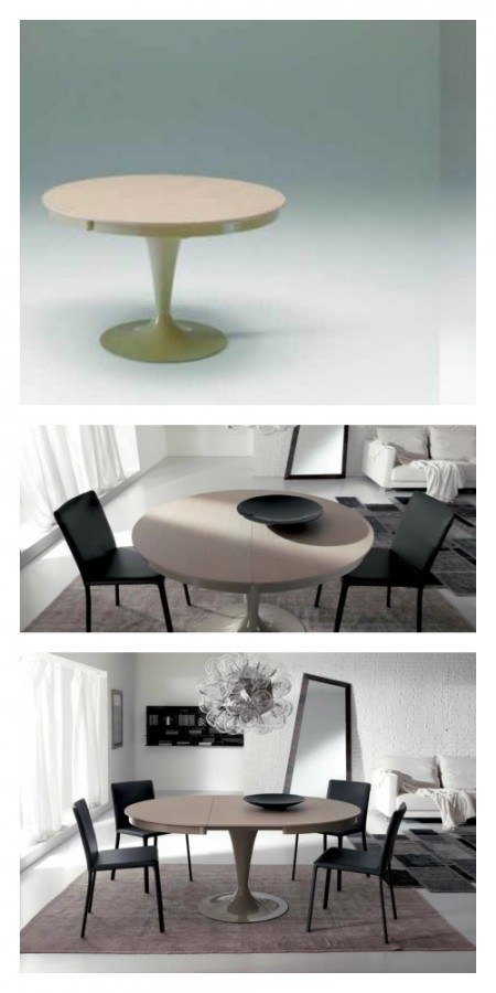 round dining table with black chairs in a black and white themed room