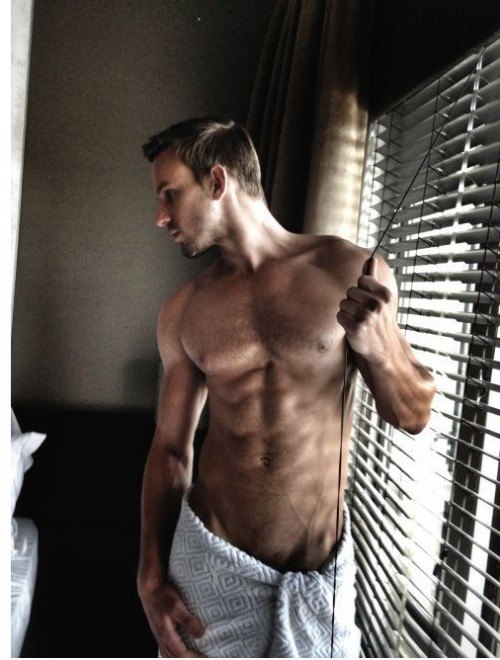 male model and a window with blinds