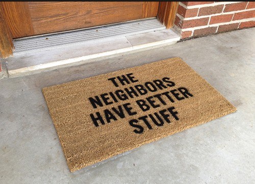 door rug with text "the neighbours have better stuff"