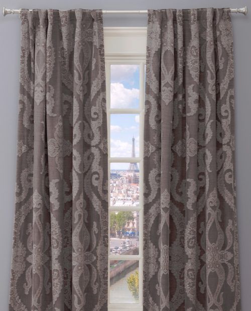 a window with printed long curtain
