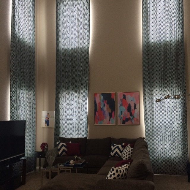 living room with extra long curtains