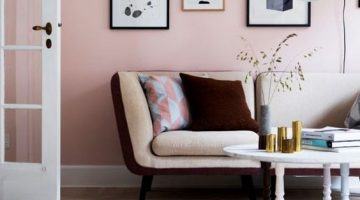 beautiful pink living room with gallery art on wall