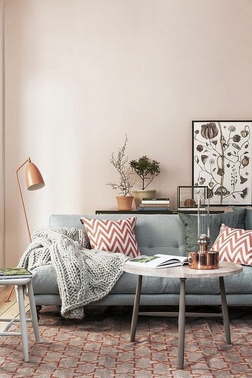 living room with gray sofa and printed area rug