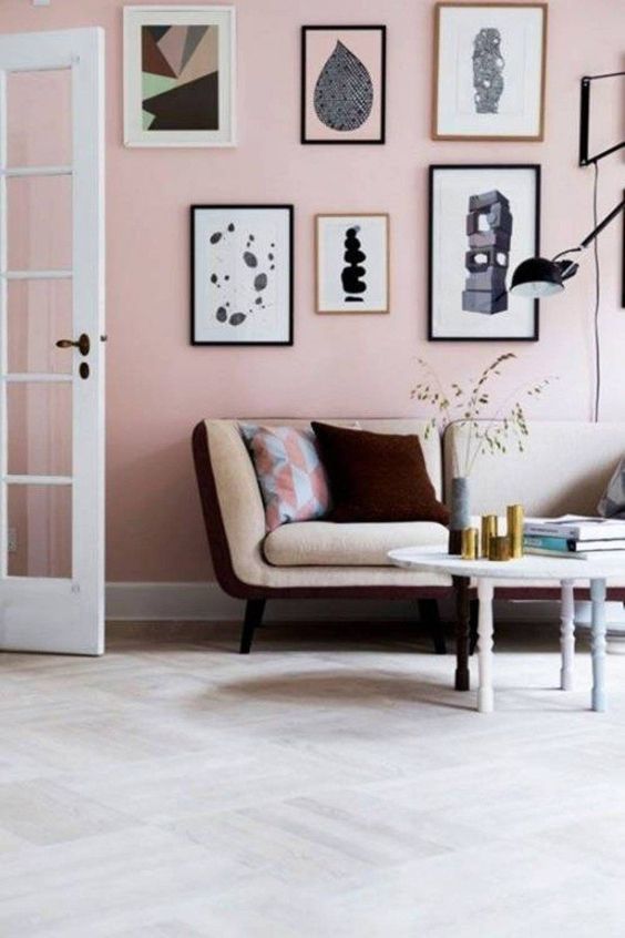living room with wall gallery in pink pastel paint