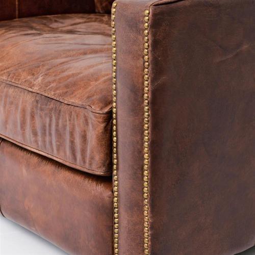a brown leather sofa 