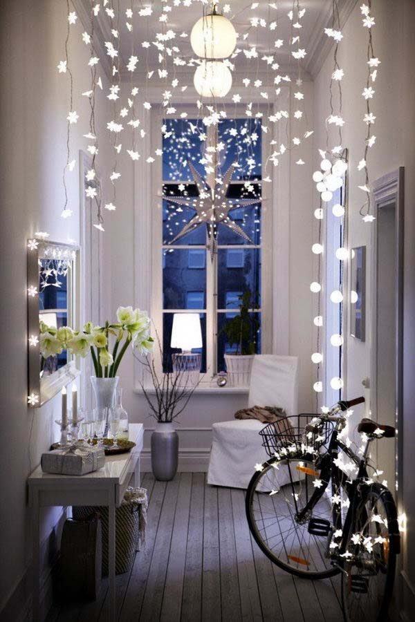 a room lit with string lights on a budget 