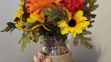 glass jar decorated with flowers