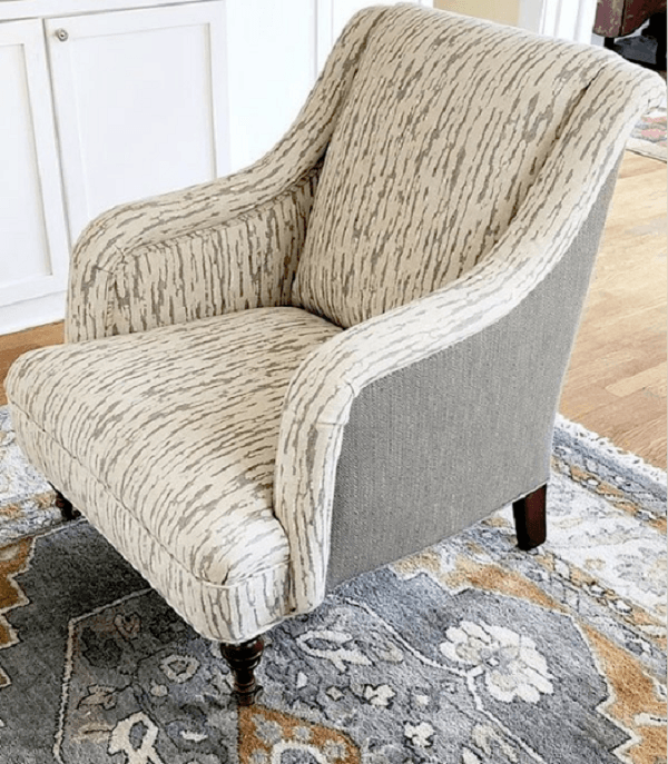 an arm chair upholstered with printed fabric