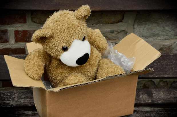 toy bear in a moving box 