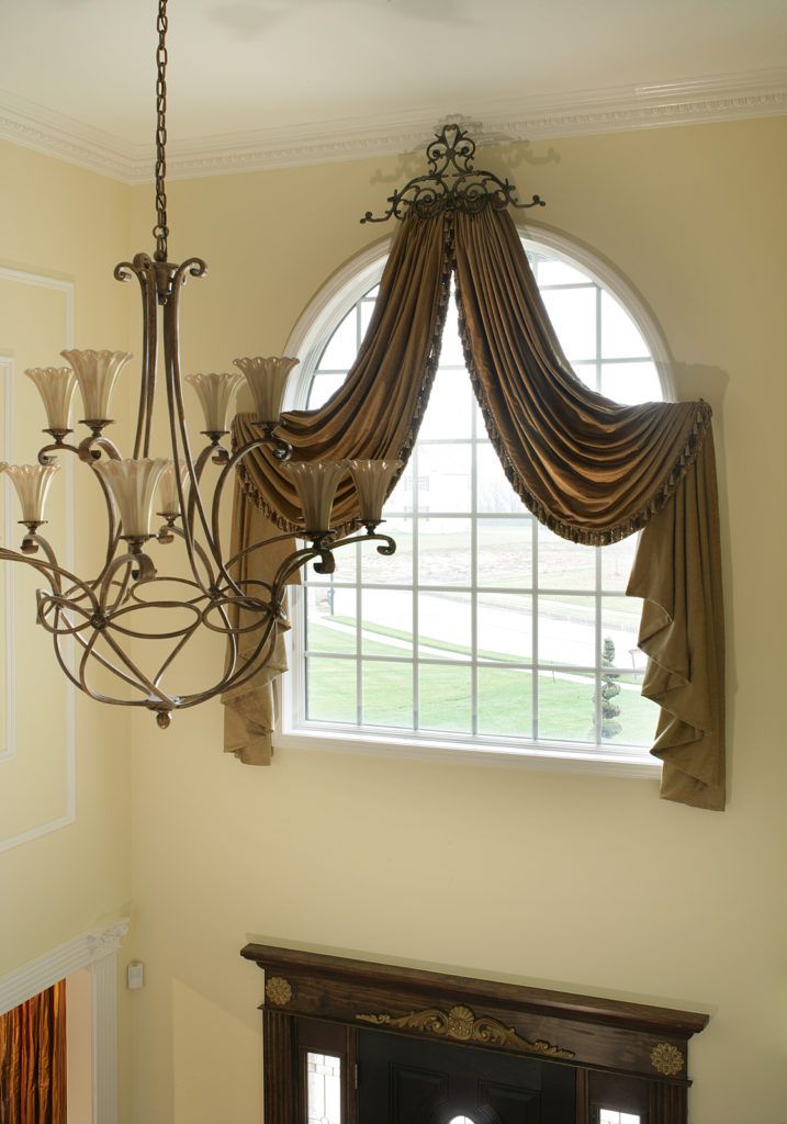 curtains over an arched window 