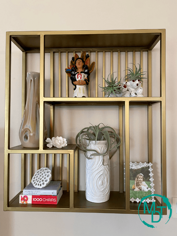 shelf decorating with white objects 